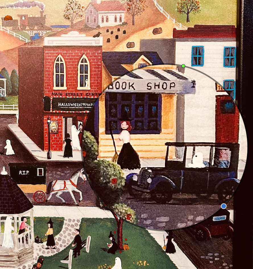 Folk art print refinished into Halloweentown. Magnified witch and book shop